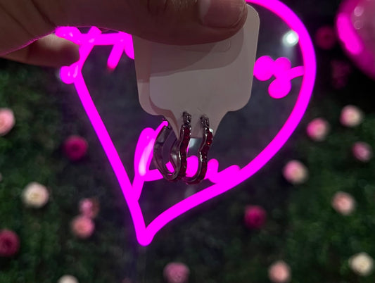 Arracadas de acero inoxidable en forma de corazon